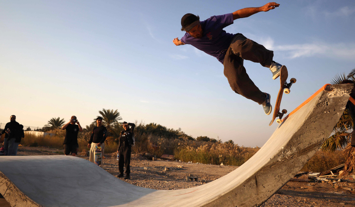 An Iraqi skateboarder performs a trick at a skatepark in Baghdad on February 1, 2025. (AFP)