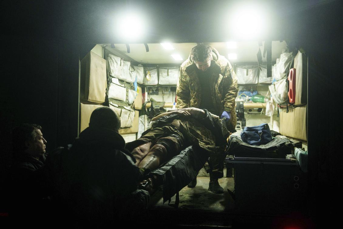 Ukrainian military medics of 59th brigade carry a wounded soldier on a stretcher from an ambulance arrived from the battlefield on Pokrovsk direction, Donetsk region in Ukraine on Jan. 29, 2025. (AP)