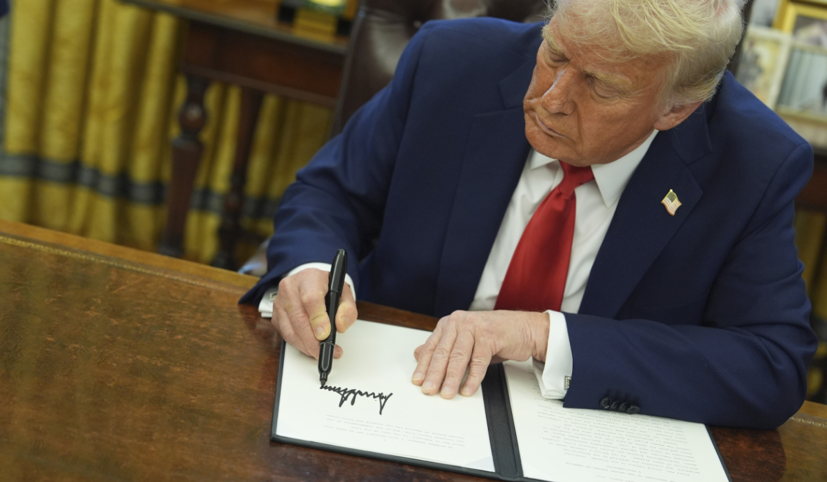 President Donald Trump signs an executive order in the Oval Office of the White House, Monday, Feb. 3, 2025, in Washington. (AP)