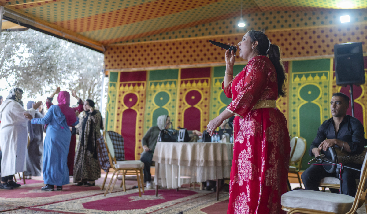 Women dance as folksinger Cheikha Thouria Moullablad gives a traditional performance known as Aita, in Tamesna, south of the capital Rabat, Morocco, Monday, Jan. 27, 2025. (AP)