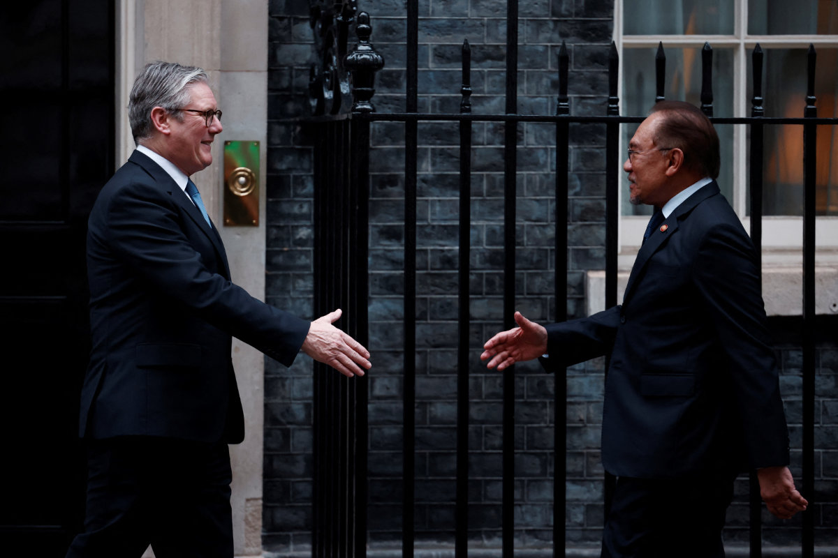 Britain's Prime Minister Keir Starmer (L) greets Malaysia's Prime Minister Anwar Ibrahim outside 10 Downing Street in London on January 15, 2025 ahead of their meeting. (AFP file)