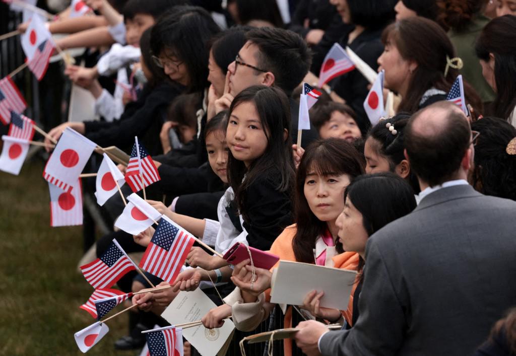 Guests wait for the arrival ceremony for Prime Minister Fumio Kishida and Mrs. Yuko Kishida of Japan at White House on April 10, 2024 in Washington, DC. (AFP)
