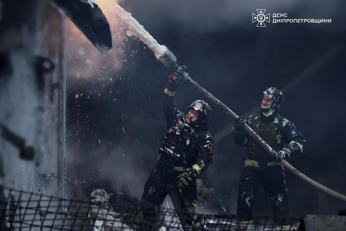 Ukrainian firefighters put out a fire following a Russian missile attack on the country’s energy system in Dnipropetrovsk region on Dec. 25, 2024. (Ukrainian Emergency Service via AP)