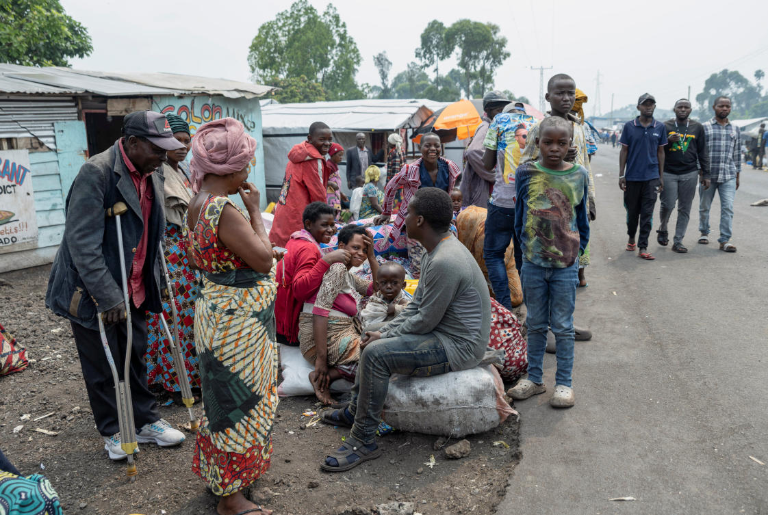 Displaced people wait along the road for transport back to their villages, days after the M23 rebel group seized the town of Goma, in North Kivu of Congo, on Feb. 3, 2025. (Reuters)