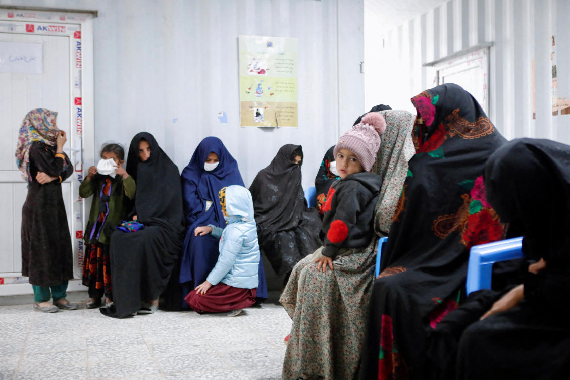 Afghan women and children wait for their turn to see a doctor at Yaka Dokan health clinic run by nonprofit organization World Vision, in Yaka Dokan village, Herat, Afghanistan, Oct. 23, 2024. (Reuters/File)