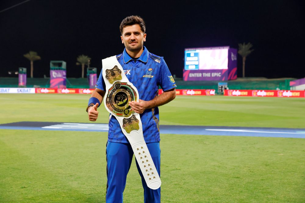 MI Emirates’ Fazalhaq Farooqi with the White Belt for the Highest Wicket Taker after the DP World ILT20 match against the Dubai Capitals at Zayed Cricket Stadium in Abu Dhabi. (Deepak Malik/ILT20)