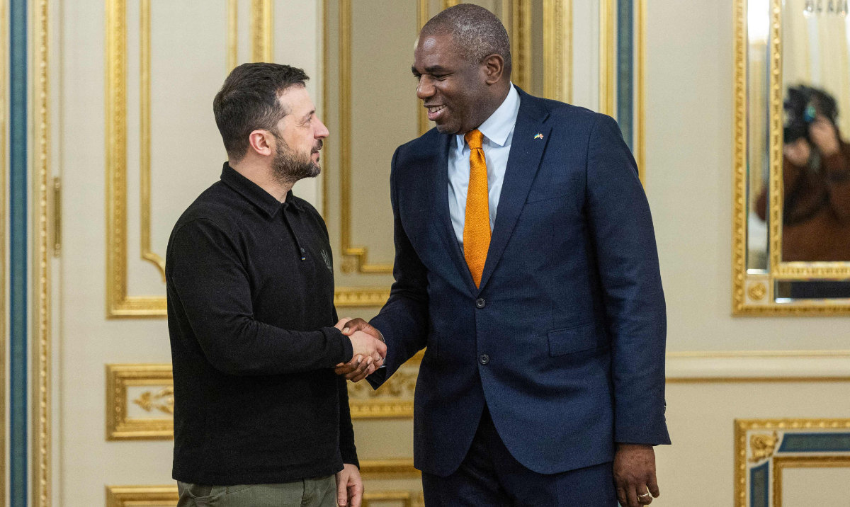 This handout photograph taken and released by Ukrainian Presidential Press Service on February 5, 2025, shows Ukrainian President Volodymyr Zelensky (L) welcomes Britain's Foreign Secretary David Lammy (R) during their meeting in Kyiv, amid the Russian invasion of Ukraine. (AFP)