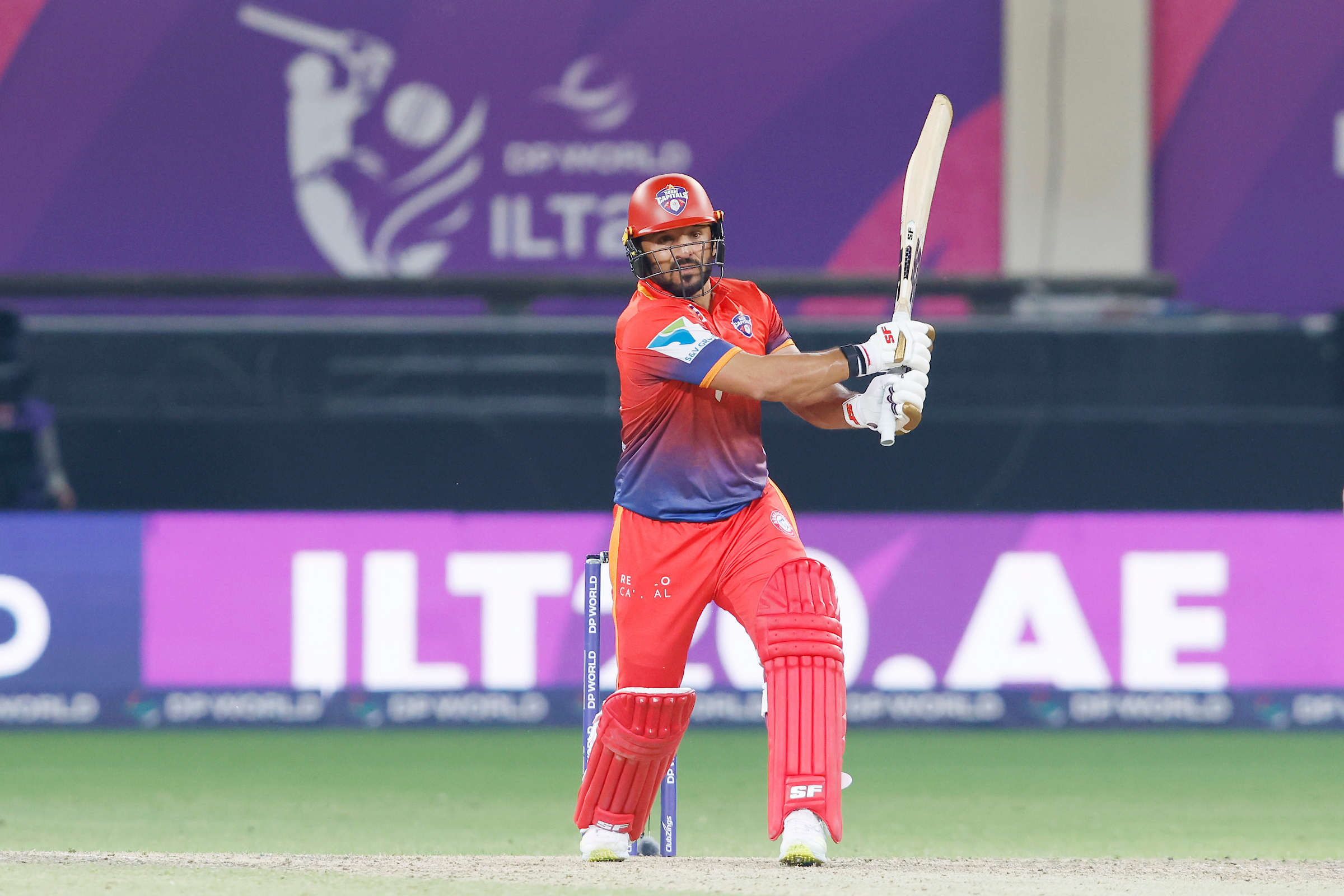 Gulbadin Naib of Dubai Capitals plays a shot during his team's win in the Qualifier 1 of the DP World ILT20 against the Desert at the Dubai International Stadium. (Vipin Pawar/ILT20)