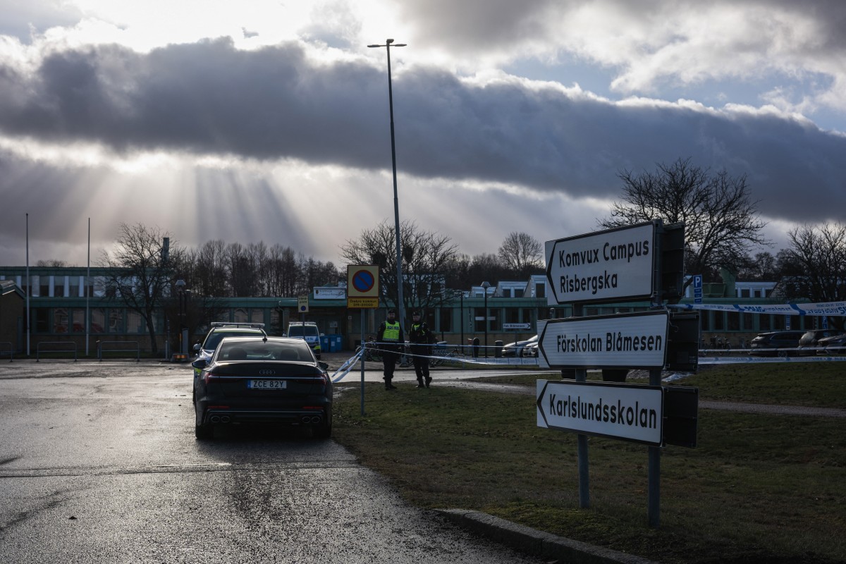 Police officers stand guard outside the adult education center Campus Risbergska school in Orebro, Sweden, on February 5, 2025 one day after a shooting there left eleven people dead (AFP)
