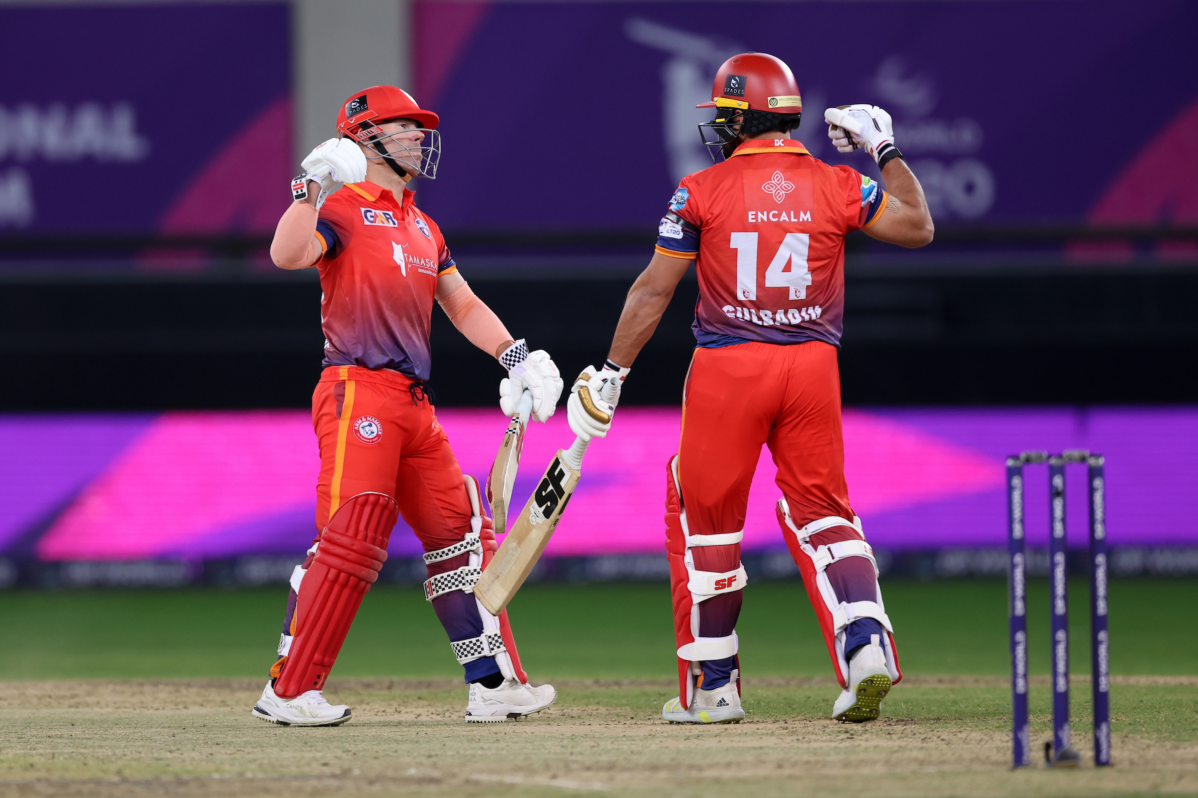 David Warner and Gulbadin Naib of Dubai Capitals celebrate during the DP World ILT20 win over the Abu Dhabi Knight Riders at the Dubai International Stadium. (CREIMAS/ILT20)