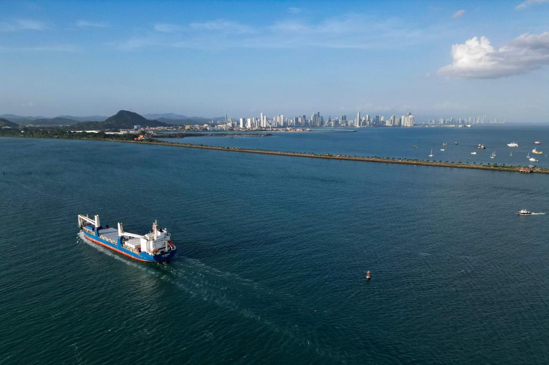 In this aerial view a cargo ship enters the Panama Canal on the Pacific Ocean side in Panama City on February 4, 2025. (AFP)