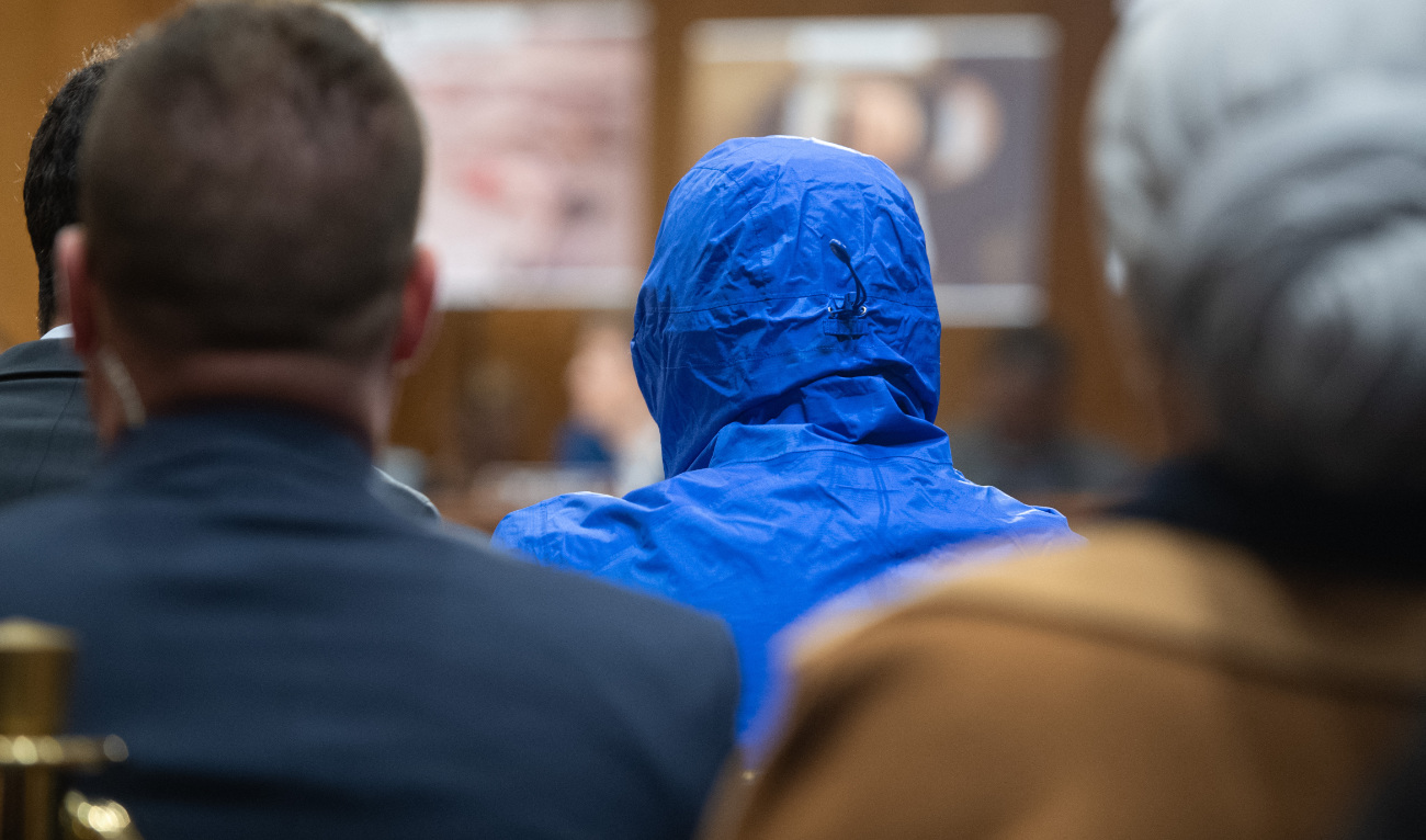 Caesar wearing a hood to protect his identity testifies about the war in Syria during a Senate Foreign Relations committee hearing on Capitol Hill in Washington, DC, March 11, 2020. (AFP/File)