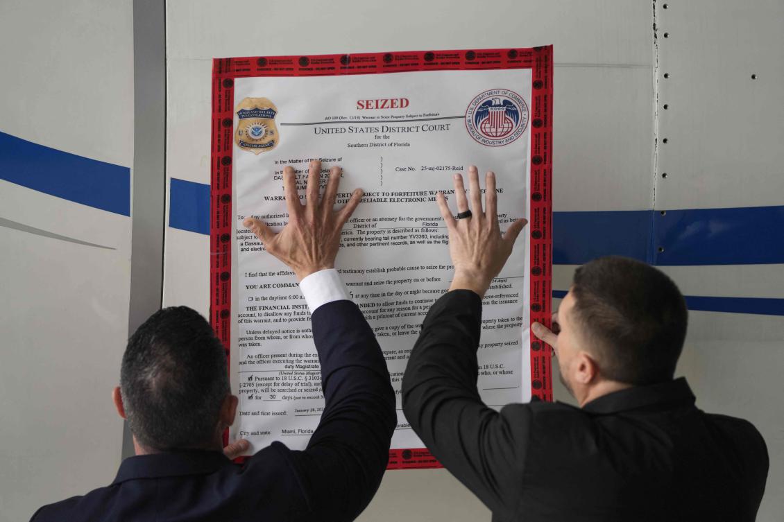 A “seized” sign is placed on a Venezuelan government airplane during a press conference where US Secretary of State Marco Rubio announced its seizure at La Isabela International Airport in Santo Domingo, on February 6, 2025.