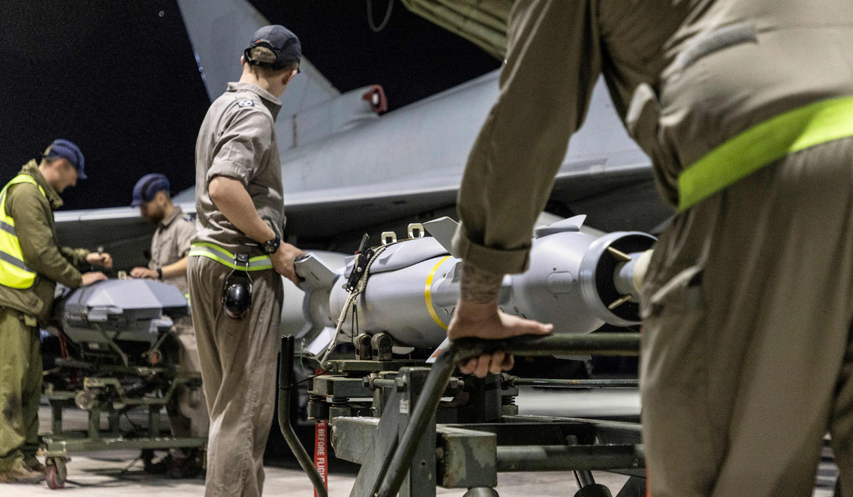A Royal Air Force Typhoon FGR4 having Paveway IV weapons loaded by Weapon Technicians at RAF Akrotiri in Cyprus, in preparation for a strike on military targets in Yemen, on February 22, 2024. (AFP)
