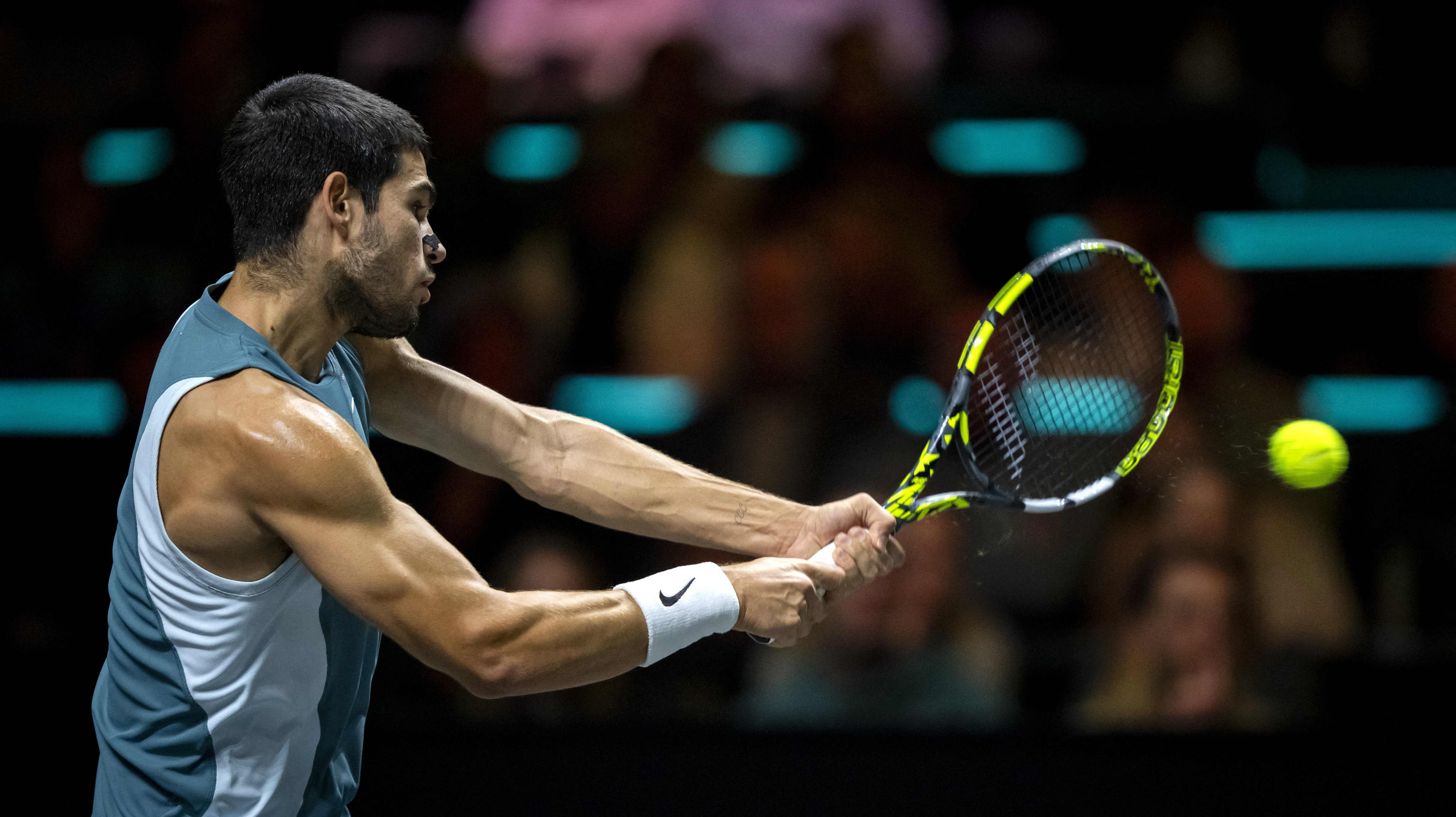 Spain's Carlos Alcaraz plays a backhand return to Spain's Pedro Martinez on the fifth day of the ATP Tour Rotterdam Open tennis tournament at the Ahoy venue in Rotterdam, on Feb. 7, 2025. (AFP)