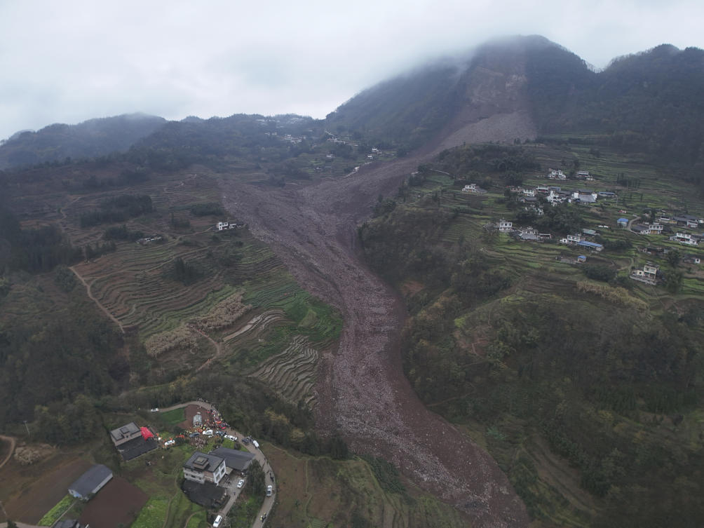 Above, an aerial drone photo shows the site of a landslide in Jinping Village, Junlian County in the city of Yibin, southwest China’s Sichuan Province on Feb. 8, 2025. (Xinhua via AP)
