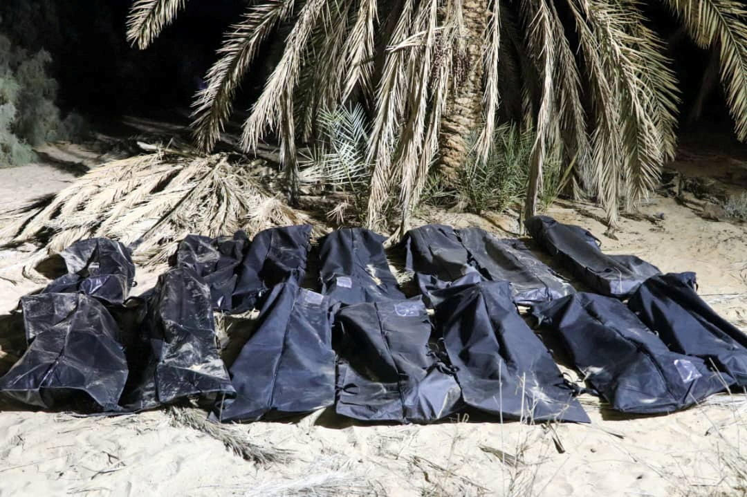 Bodies of migrants lie in bags, after they were discovered in a mass grave in a farm in Jikharra area, some 441 km from Benghazi, in Jikharra, Libya, February 5, 2025. (Reuters)