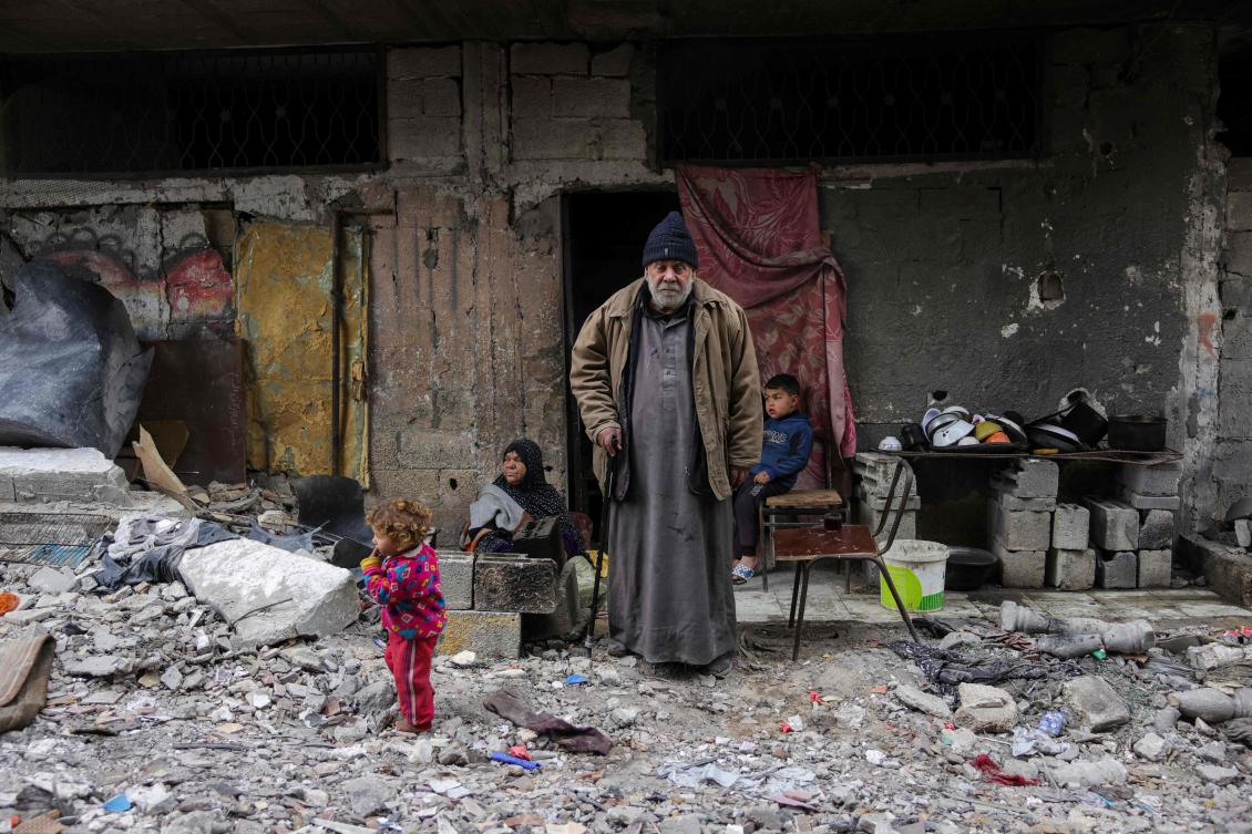Talal Al-Assali, 64, poses in front of his destroyed home in Jabalia, northern Gaza Strip, on February 9, 2025. (AFP)