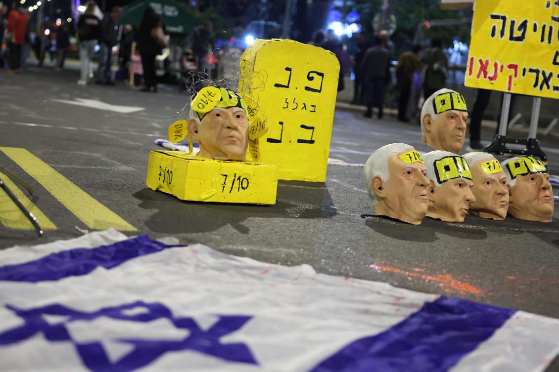 Masks representing Israel's Prime Minister Benjamin Netanyahu are set up by demonstrators during a protest calling for the release of hostages held captive in Gaza, Feb. 8, 2025. (AFP)