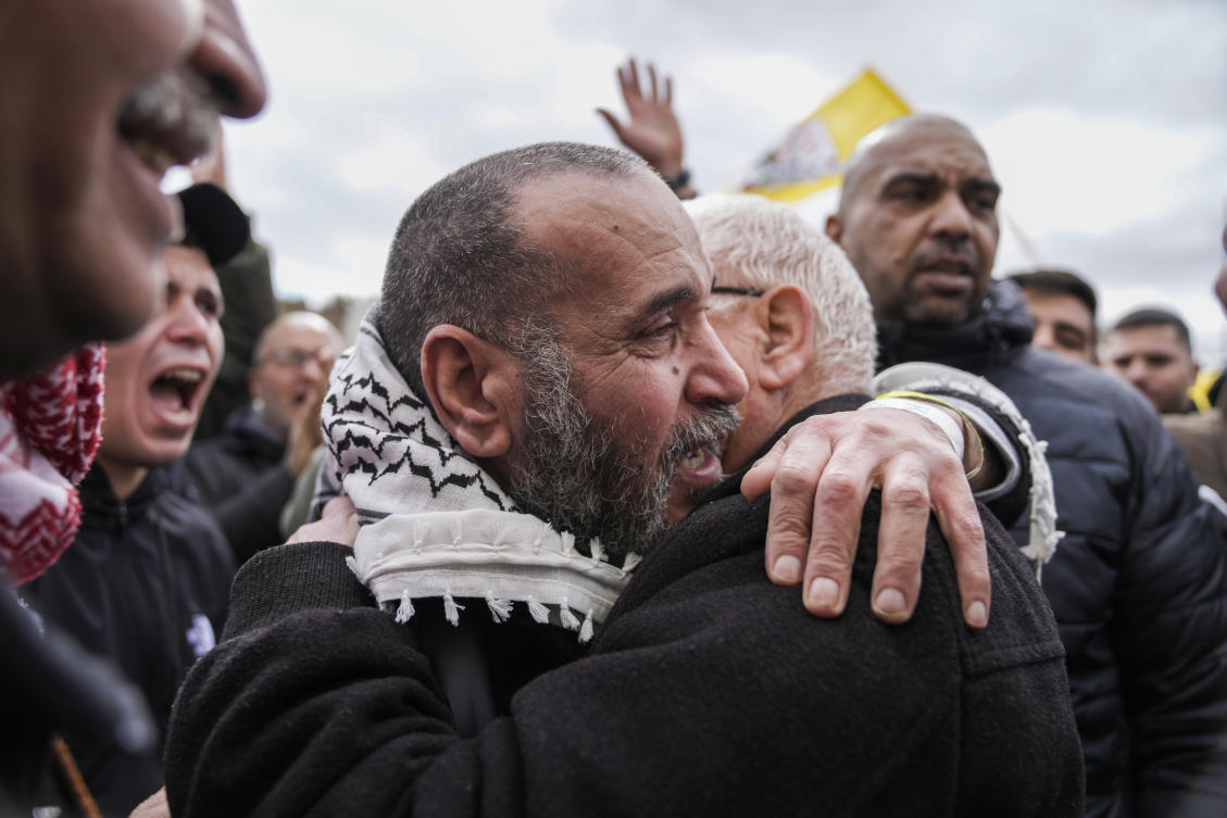 Palestinian prisoners are greeted as they exit a Red Cross bus after being released from Israeli prison, in the West Bank city of Ramallah, Saturday Feb. 8, 2025. (AP)