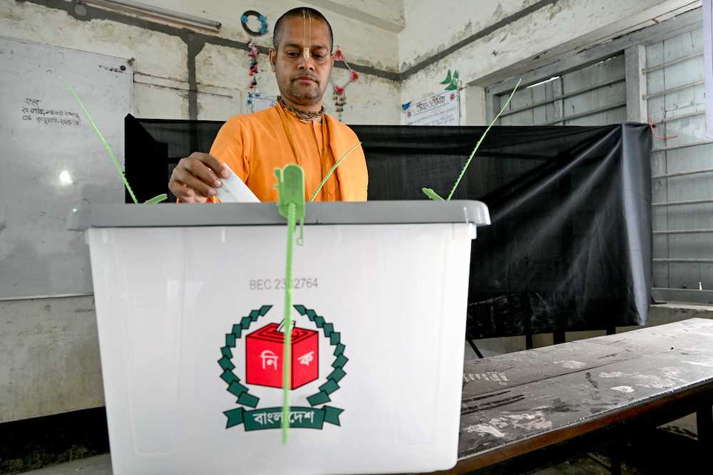 A Bangladeshi man casts his ballot to vote during the country’s general election in Dhaka on Jan. 7, 2024. (AFP)