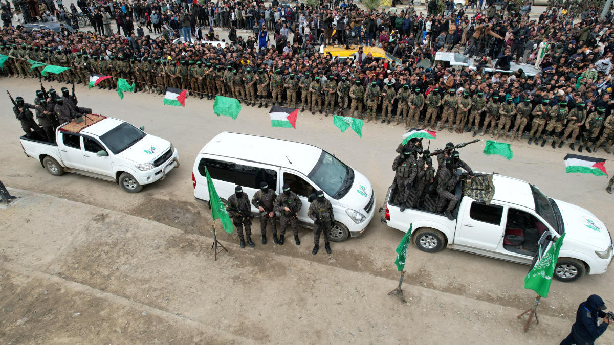 A drone view shows Palestinian Hamas militants parading on the day some hostages held in Gaza were released as part of a ceasefire and a hostages-prisoners swap deal in Deir Al-Balah in the central Gaza Strip. (File/Reuters)
