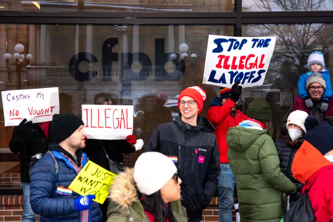 People gather for a protest outside the closed offices of the Consumer Financial Protection Bureau on February 12, 2025 in Washington, DC. (Getty Images/AFP)