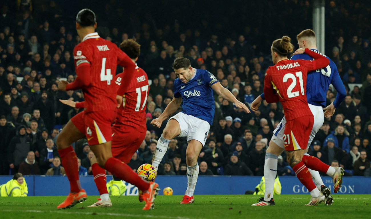 Everton’s James Tarkowski scores their second goal during the Premier League match against Liverpool at the Goodison Park, Liverpool Wednesday. (Reuters)