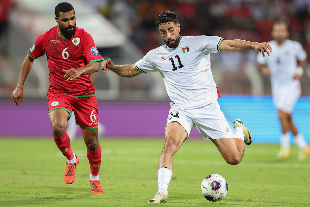 Palestine international Oday Dabbagh’s, right, loan to Aberdeen comes with an option to buy in the region of $1m that can be triggered at the end of the season. (AFP)