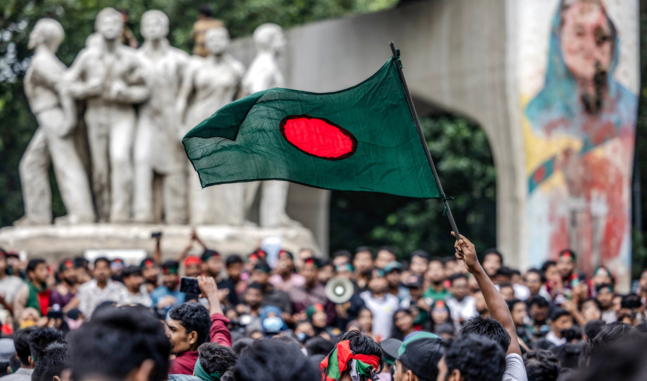 A student waves Bangladesh's national flag, during a protest to demand accountability and trial against the country's ousted Prime Minister Sheikh Hasina, near Dhaka University in the capital on August 12, 2024. (AFP/File)