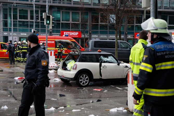 Members of the emergency services work at the scene where a car drove into a crowd in the southern German city of Munich on Feb. 13, 2025 leaving several people injured, police said. (AFP)