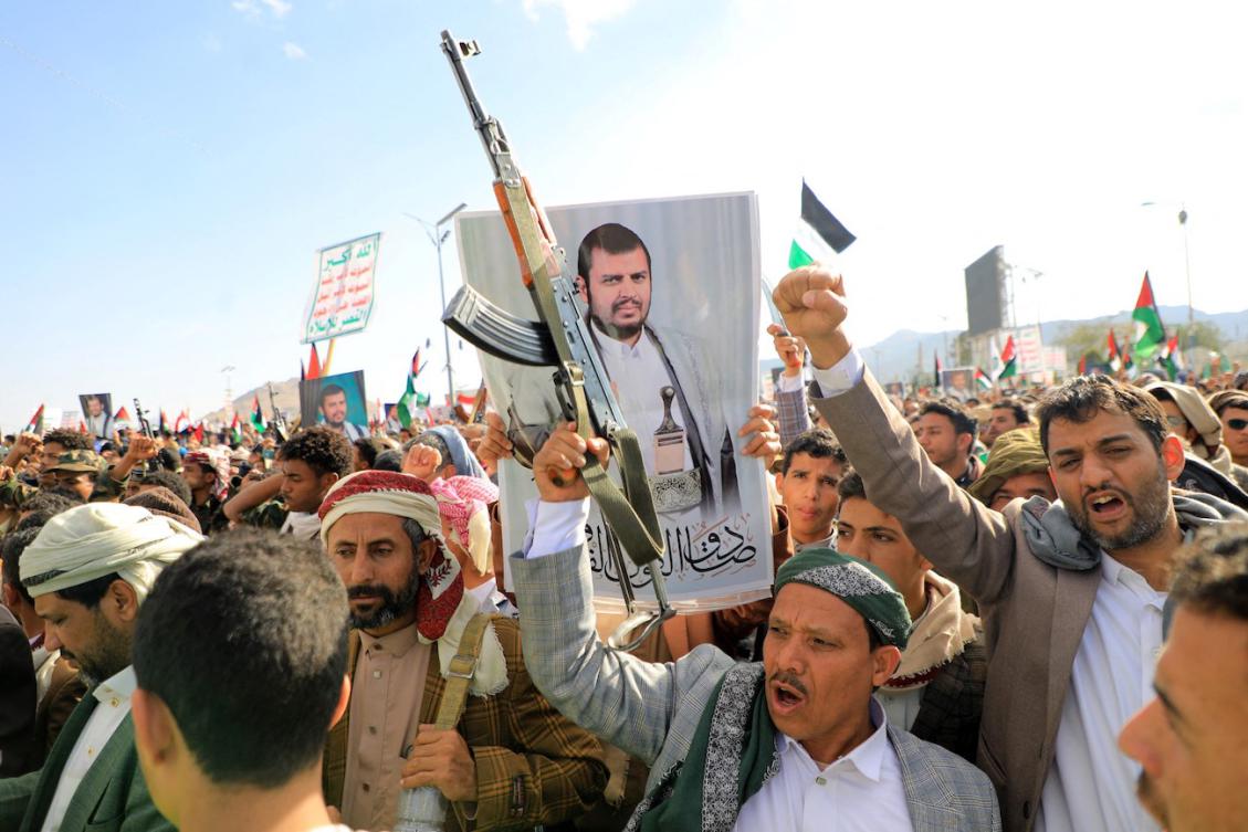 Demonstrators, one with a portrait of Houthi leader Abdul Malik Al-Houthi, shout slogans during a march in solidarity with the people of Gaza, in Sanaa. (File/AFP)