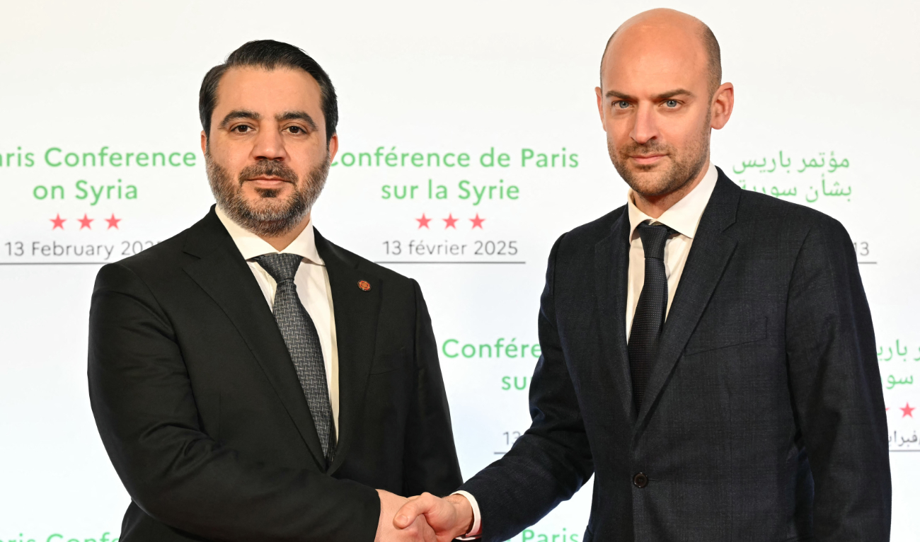 Syria’s Minister of Foreign Affairs Asaad Hassan Al-Shibani shakes hands with his French counterpart in Paris on Thursday. (AFP)
