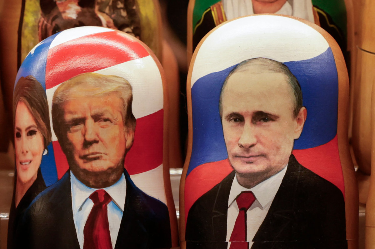 Traditional Russian wooden nesting dolls, Matryoshka dolls, depicting Russia's President Vladimir Putin (R), US President Donald Trump and his wife Melania (L) are displayed for sale at a gift shop on the touristic Arbat street in downtown Moscow on February 13, 2025. (AFP)