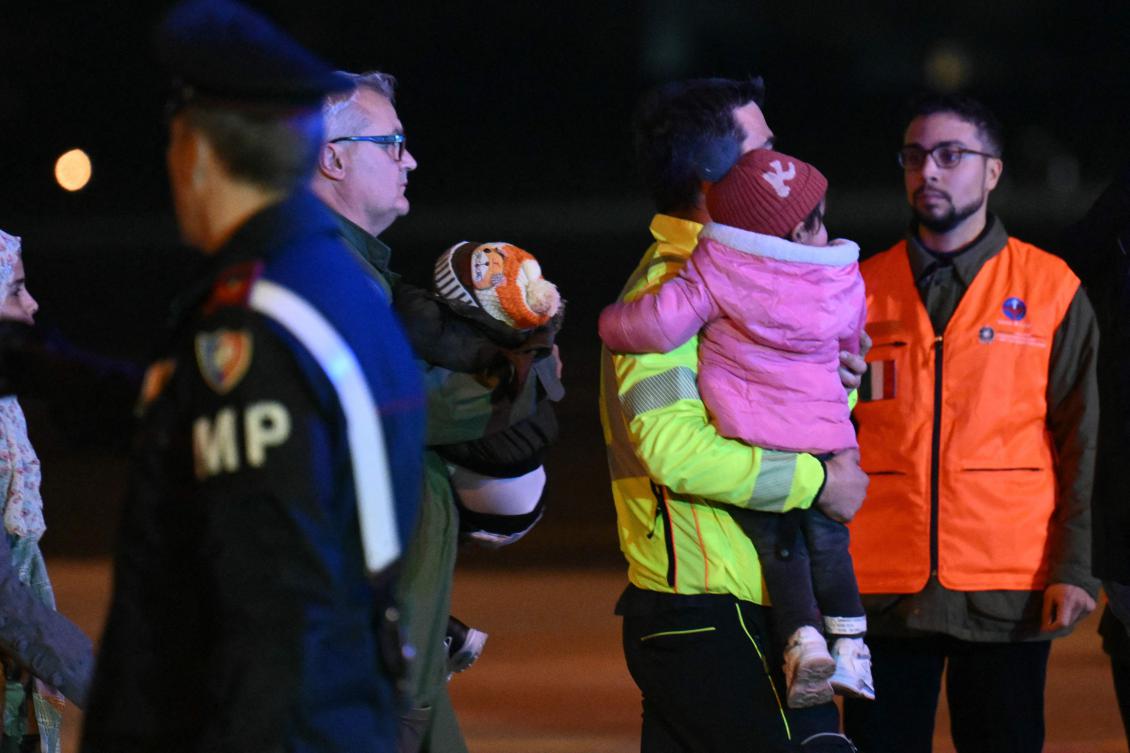Medics and health personnel welcome Palestinian children from Gaza, after a military plane from Egypt landed on February 13, 2025, at Rome’s Ciampino airport.(AFP)