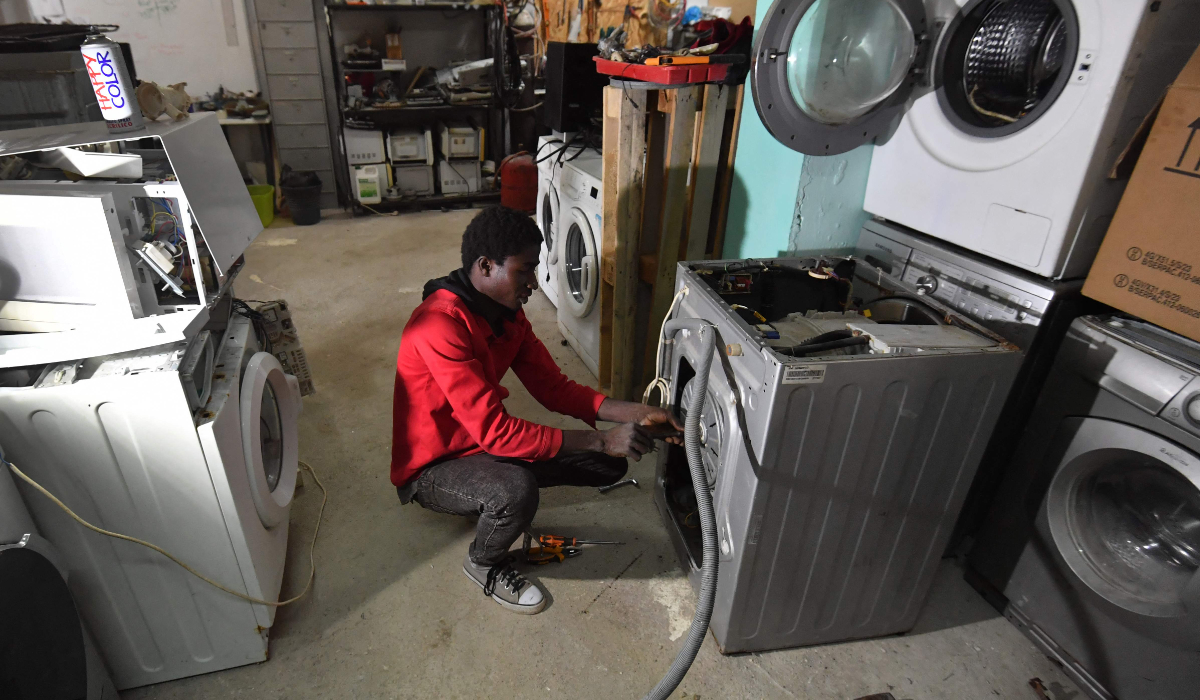 A technician works at Wefix, a startup business founded by Sabri Cheriha,a Tunisian engineer turned social entrepreneur, in Tunis, on January 24, 2025. (AFP)