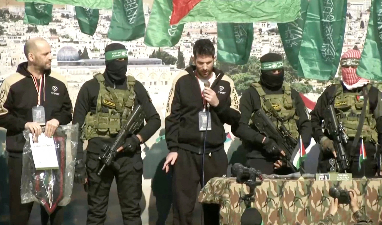 The screengrab taken from a video shows Hamas and Islamic Jihad fighters stand in formation ahead of a hostages’ release in Khan Younis, Gaza Strip, on February 15, 2025. (REUTERS)