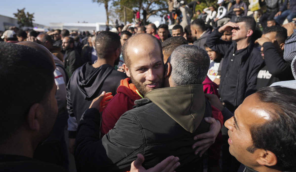 A freed Palestinian prisoner is greeted by relatives in Khan Younis, Gaza Strip, Saturday, Feb. 15, 2025, as he arrive in Gaza following his release from an Israeli prison as part of a ceasefire agreement between Hamas and Israel. (AP)