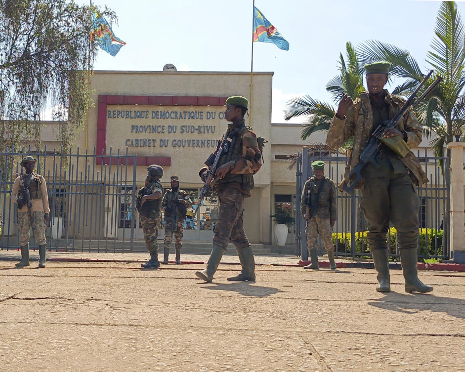 M23 rebels guard outside the South Kivu province administrative office, at the centre of east Congo's second-largest city, Bukavu, Sunday, Feb. 16, 2025. (AP)