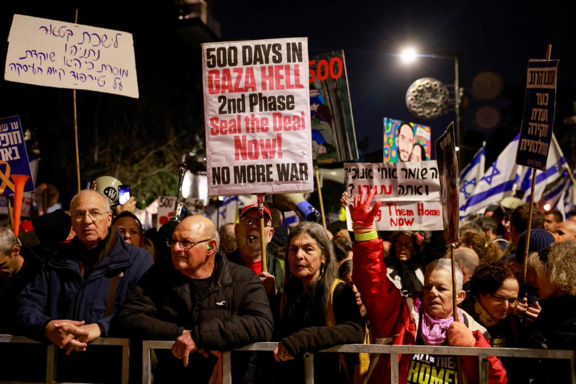 Relatives and supporters of Israeli hostages held captive in Gaza since the October 7, 2023 attacks by Hamas rally calling on the government for a deal to secure the captives, outside the prime minister residence in Jerusalem on February 17, 2025, which marks the 500th day since their abduction. (AFP)