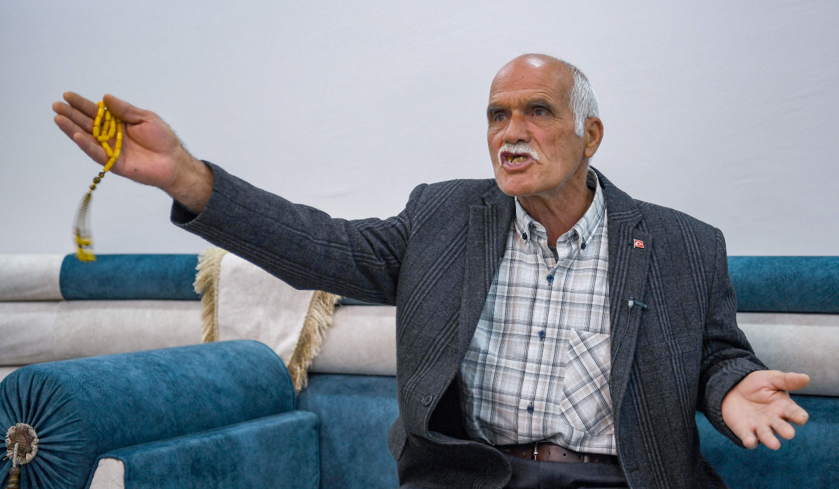 Turkish Kurd Sehmuz Kaya recalls how his son Vedat, a police officer, was kidnapped by PKK militants in eastern Turkey in July 2015, during an interview in Mardin, southeastern Turkey, on February 14, 2025. (AFP)