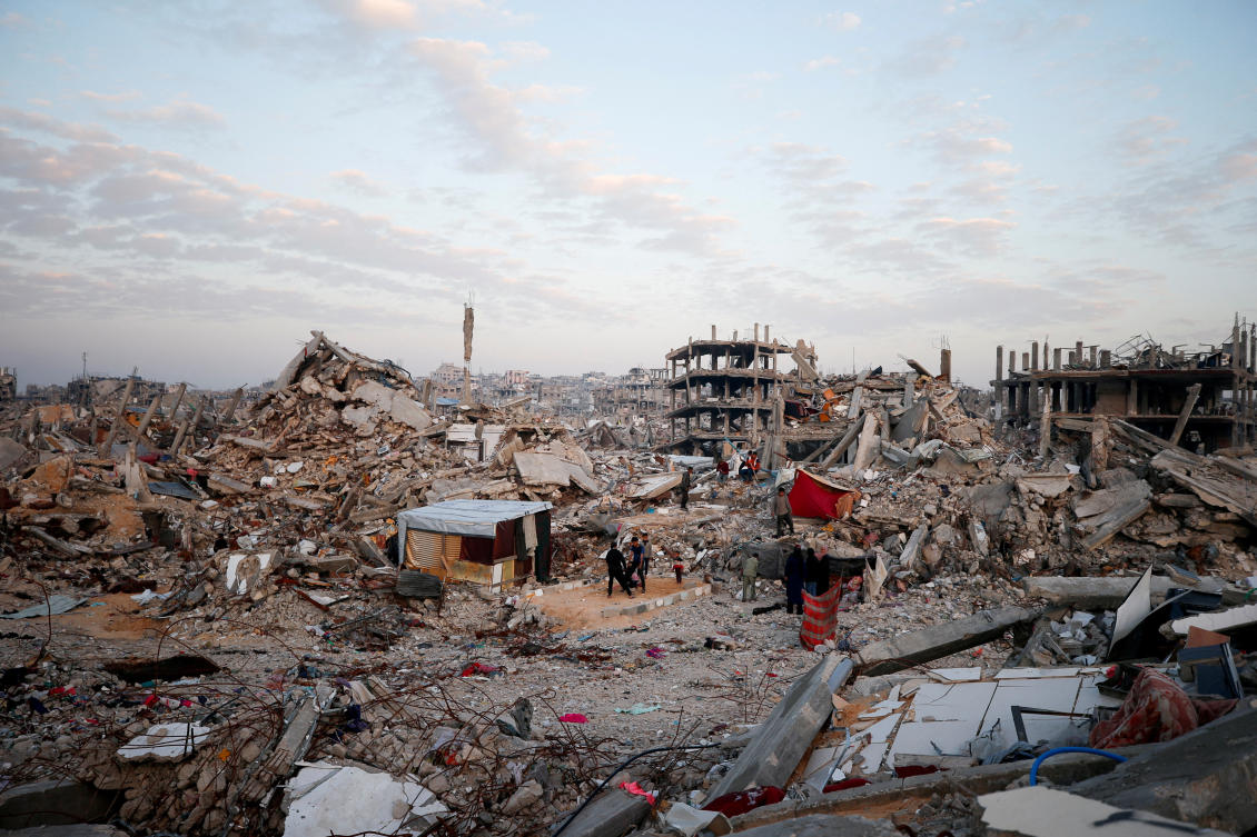 Palestinians gather among the rubble of buildings destroyed during the Israeli offensive, amid a ceasefire between Israel and Hamas, at Jabalia refugee camp, northern Gaza Strip, February 17, 2025. (REUTERS)