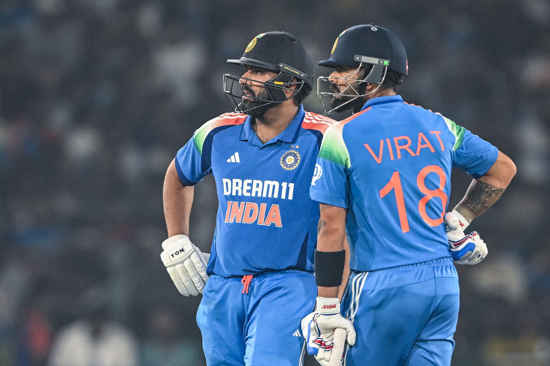 India’s Virat Kohli (R) along with his captain Rohit Sharma waits for the third umpire decision during the second one-day international (ODI) between India and England at the Barabati Stadium in Cuttack on Feb. 9, 2025. (AFP)