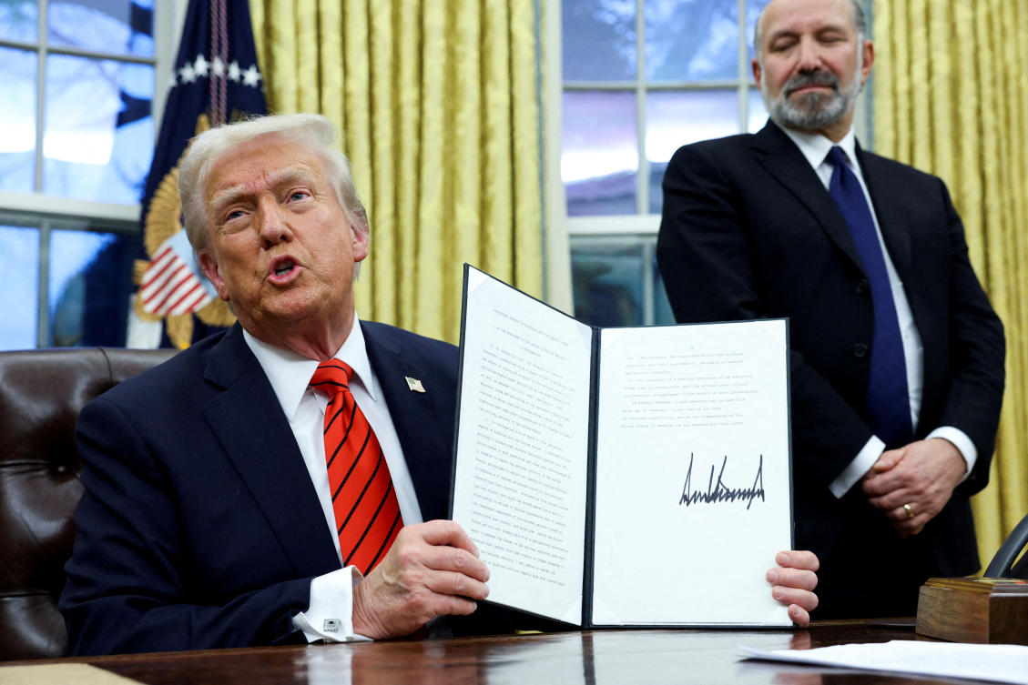US President Donald Trump holds a signed executive order on tariffs on aluminum imports in the Oval Office of the White House in Washington, February 10, 2025. (REUTERS)