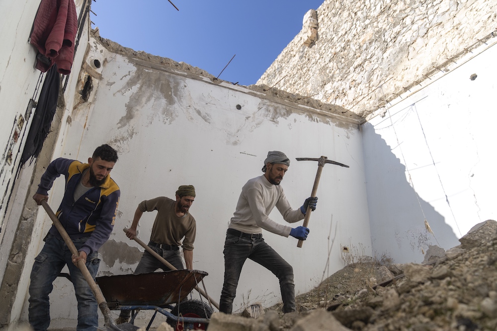 Hiba Zayadin, HRW’s senior Syria researcher, said the country “is in desperate need of reconstruction and Syrians are struggling to survive.” (AFP)