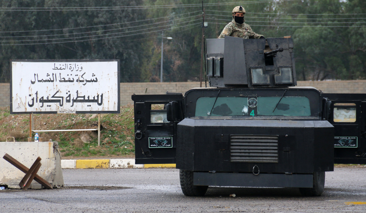 Masked Kurdish forces, loyal to the Patriotic Union of Kurdistan (PUK) party, stand guard at the North Oil Company headquarters in the northern Kurdish-controlled city of Kirkuk on March 2, 2017. (AFP)