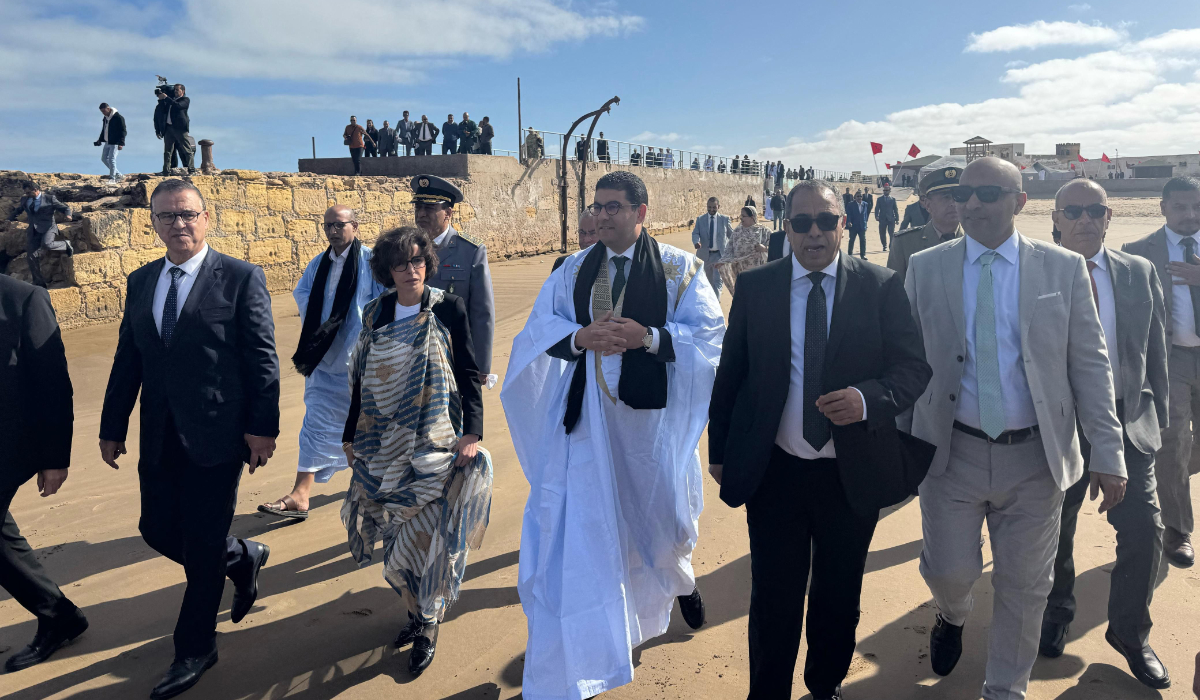 This handout photograph released by Morocco's Ministry of Youth, Culture, and Communication on February 17, 2025 shows Morocco's Minister of Youth, Culture, and Communication Mohamed Mehdi Bensaid (C) and France's Culture Minister Rachida Dati (C-L) visiting Tarfaya, in southern Morocco. (AFP)