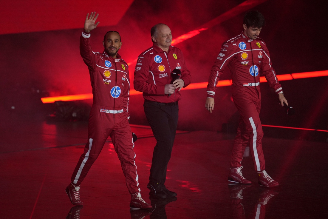 Ferrari driver Lewis Hamilton of Britain, left, Ferrari team principal Frederic Vasseur, center, and Ferrari driver Charles Leclerc of Monaco attend the F1 75 Live launch event at the O2 arena in London Tuesday. (AP)