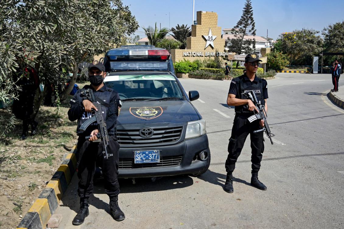 Security personnel stand guard outside the National Bank Stadium in Karachi on February 11, 2025. (AFP)