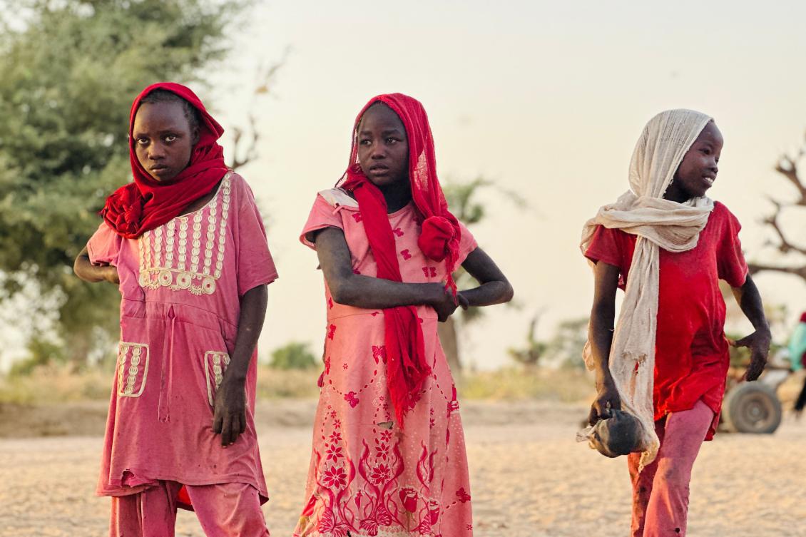Displaced Sudanese girls, who fled the Zamzam camp, look on as they gather near the town of Tawila in North Darfur on Feb. 14, 2025. (AFP)